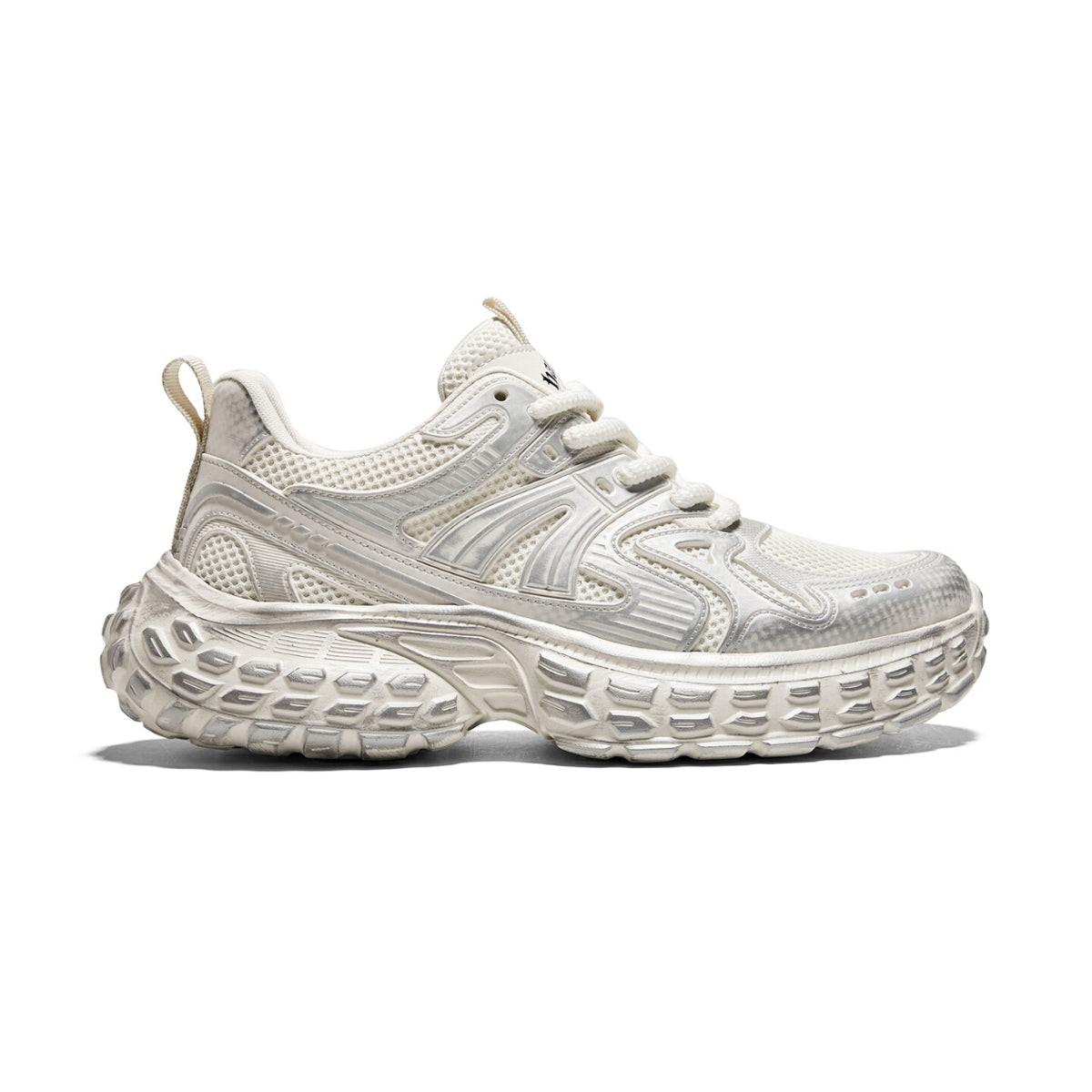 Chunky mesh trainers with multi-material upper and thick sole, combining lightweight cushioning and breathable comfort.