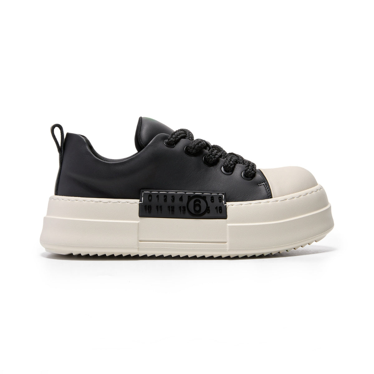 Chunky platform leather trainers in black and off-white with grain leather upper, pigskin insole, and bold stitched detailing.