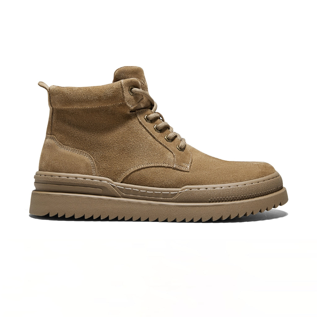 Suede Martin boots with thick sole, stitched detailing, and short lace-up shaft for a modern British-inspired look.