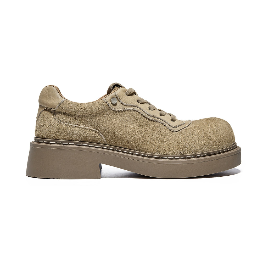 Suede workwear trainers with mixed-material upper, thick rubber sole, and stitched detailing for modern vintage appeal.